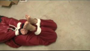 03:45 min. video with Shelly tied and gagged barefeet with shiny nylon rainwear in a cellar