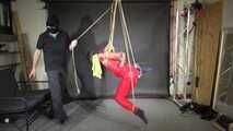 Marie bound, gagged and suspended in a shiny nylon Jumpsuit