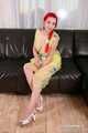 Morrigan - posing in yellow trash bag dress