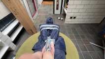 Rachel Adams bound and gagged by an Intruder in shiny Rainwear