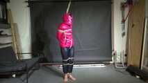 Rachel Adams bound, Pantygagged and Pantyhooded in a shiny nylon Downjacket