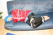 Jill tied, gagged and hooded on the sofa wearing a sexy black shiny nylon pants and two rain jackets (Pics)