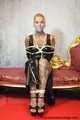 Miss Francine bound and gagged with layers of gags in a sexy PVC dress