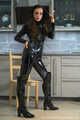 Miss Amira im sexy Lackcatsuit und Regenmantel fixiert und geknebelt