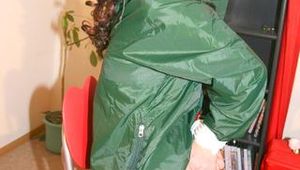 Beautiful archive girl tied and gagged on an chair wearing sexy shiny nylon shorts and a green down jacket (Pics) 