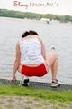 Enni having a good time outdoor wearing sexy shiny nylon shorts and a top posing for the camera (Pics)