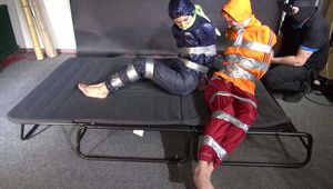 Myxxxy and Aiyana tied and gagged in shiny nylon Rainwear