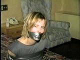 Flight Attendant Wrapped Tied & Gagged with Duct Tape (D22-4)