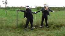 Jasmin & Larissa tied on fence Photoshoot