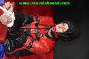 Sexy PIA wearing a sexy blue rainbib and a black/red shiny nylon rainjacket being tied, gagged and hooded on a chair with ropes and a ballgag (Pics)
