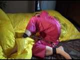 Get 2 Videos with Lucy bound and gagged enjoying her shiny nylon Rainwear from our 2016 Archive