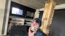Lana tied and gagged and gagged to Post in shiny nylon Rainwear