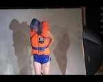 Mara wearing a sexy shiny swimsuit and a shiny nylon shorts trying on a lifevest (Video)
