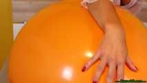 red fingernail popping of seven balloons