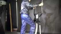 Watching sexy SONJA wearing a sexy black/blue rainwear combination and trainers during her workout (Video)