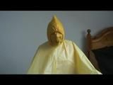 Jill tied and gagged on a chair wearing a yellow rainsuit and coveres with an yellow raincoat with two hoods (Video)