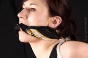 Julia tied and gagged in shiny nylon shorts