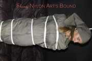 Sexy Sandra being tied and gagged overhead with ropes and a clothgag hodded wearing a sexy rainwear combination (Pics)