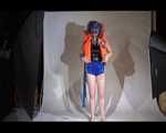 Mara wearing a sexy shiny swimsuit and a shiny nylon shorts trying on a lifevest (Video)