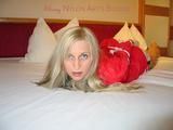Beautiful archive girl tied and gagged on a bed wearing shiny shorts (Pics)