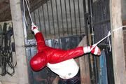 Katharina tied and gagged in a shiny nylon downjacket