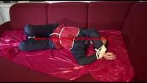 Lucy tied, gagged and hooded on a sofa wearing an oldschool rainwear combination (Video)