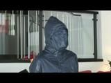 03:40 Min. video with Nicole tied and gagged in shiny nylon rainwear