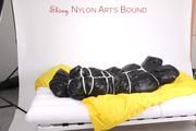 Jill tied and gagged in an big shiny down bag to lie in (Pics)