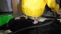 Pia wearing sexy yellow shiny nylon rainwear cleaning up the studio (Video)