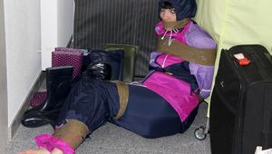 Jill tied and gagged in shiny nylon rainware