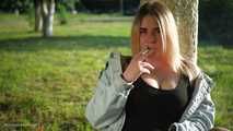 Nastya is smoking in the park