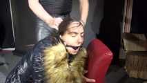 Watching our new model "AIYANA" wearing a sexy shiny nylon rain pants and a black down jacket being bound on a barstool, gagged with a ballgag, dominated and hooded from Dark Temptation Part two (Video)