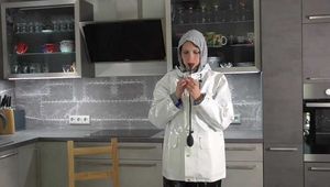 Miss Petra in nylon rain suit and heavy farmerrain rain gear and selfgagging