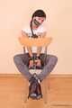Marvita - Sexy lady Marvita in fishnet stockings locks herself to a chair