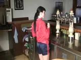 Jill in a bar wearing a sexy blue/red shiny nylon shorts and a red rain jacket (Video)
