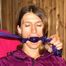 Katharina tied and gagged in a shiny nylon rainsuit and a raincape