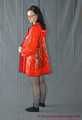 Bound in PVC minidress and red raincoat