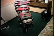 25 Yr OLD 2nd GRADE SCHOOL TEACHER IS MUMMY WRAPPED AND GAGGED WITH PLASTIC WRAP, BLACK ELECTRICAL TAPE AND SILVER DUCT TAPE ON A CHAIR (D68-13)