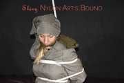 Sexy Sandra being tied and gagged overhead with ropes and a clothgag hodded wearing a sexy rainwear combination (Pics)