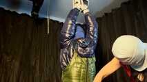 Sebastien tied by the hands in a down jacket.