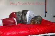 ***NEW MODEL*** Sandra wearing highheels and a sexy red crazy sensation skibib as well as a grey down jacket tied and gagged on a sofa with tape (Pics)