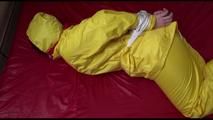 Jill tied, gagged and hooded on a bed wearing wonderful shiny yellow rainwear (Video)
