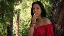 Elizaveta is smoking two all white cigs in a row