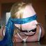 Hogtied on a table 
