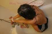 Stella tied and gagged with ropes and a cloth gag in a bath tub wearing ONLY a sexy black shiny nylon shorts (Pics)