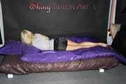 Watching Pia preparing her bed wearing a sexy black shiny nylon shorts and a grey tshirt (Pics)