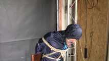 Marie bound and gagged in shiny nylon Rainwear