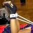 Lulu tied and gagged on a bed wearing a supersexy purple shiny nylon shorts, high heels and a purple rain jacket (Pics) 