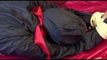 Lucy tied, gagged and hooded on a sofa wearing an oldschool rainwear combination (Video)