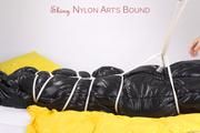 Jill tied and gagged in an big shiny down bag to lie in (Pics)